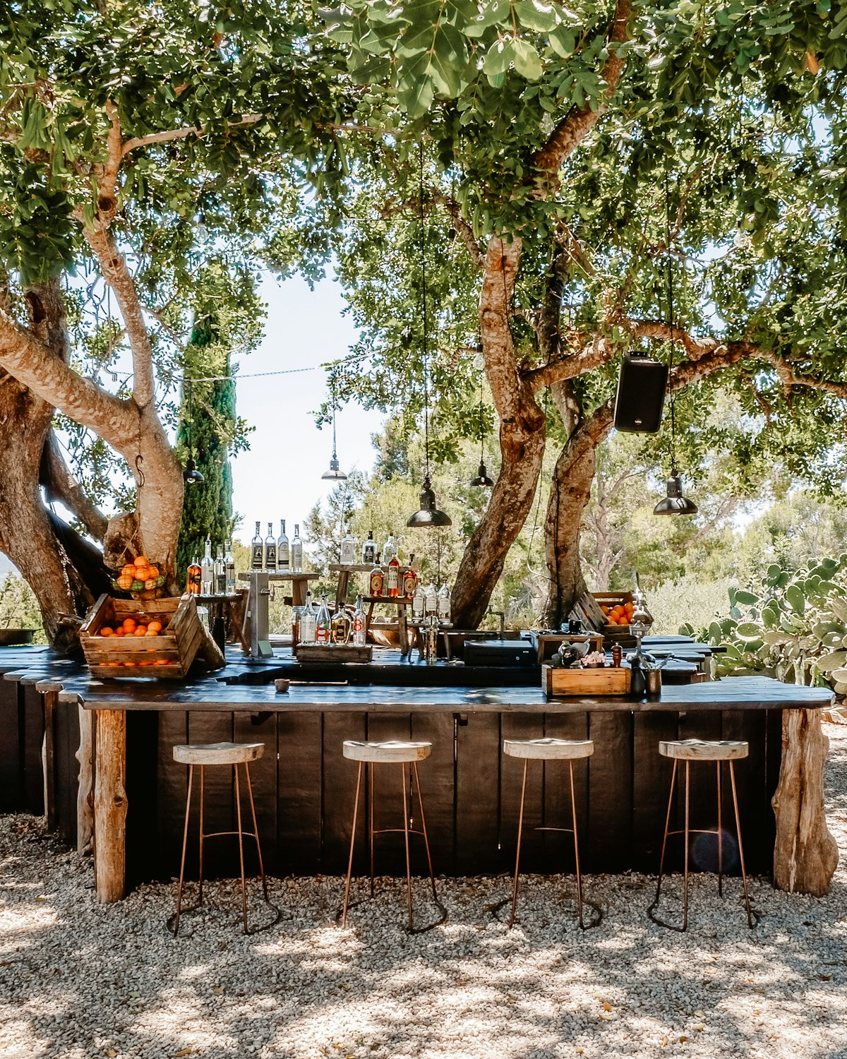 Built-in outdoor kitchen with stone counters and stainless grill